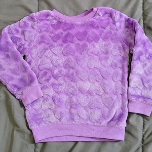 Purple fuzzy sweatshirt with heart pattern